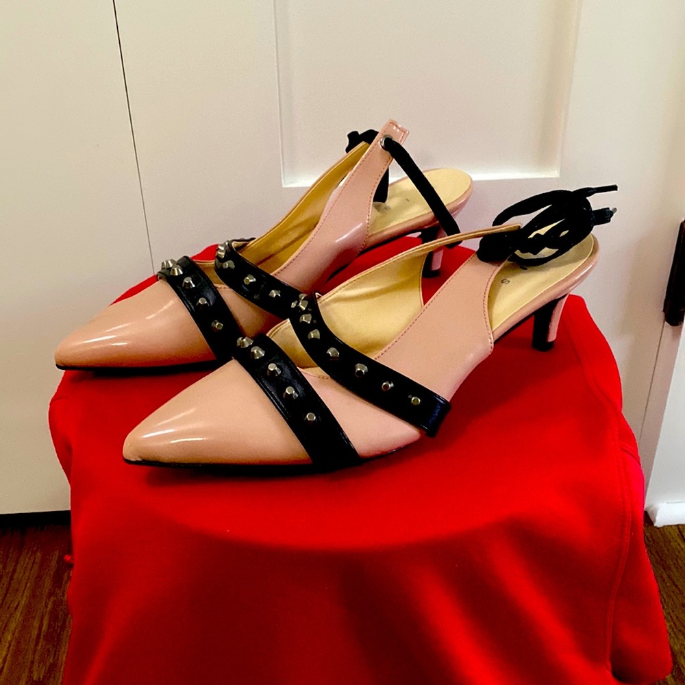 These rock heels are Sisley shoes in a glossy pink base with matte black straps.